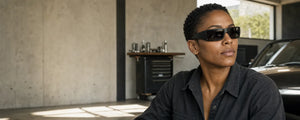 Oakley-compatible Gascan replacement lenses beside a thick rectangular wrap sunglass frame